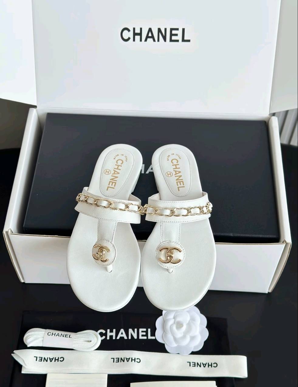 Luxury diamond-quilted flat slides with metal embellishments