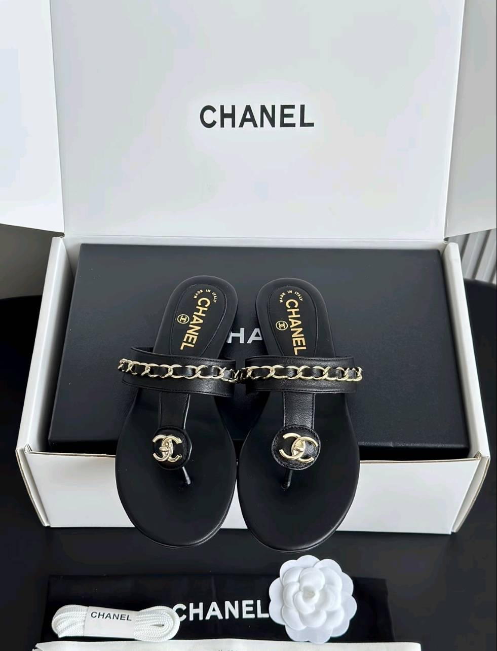 Luxury diamond-quilted flat slides with metal embellishments
